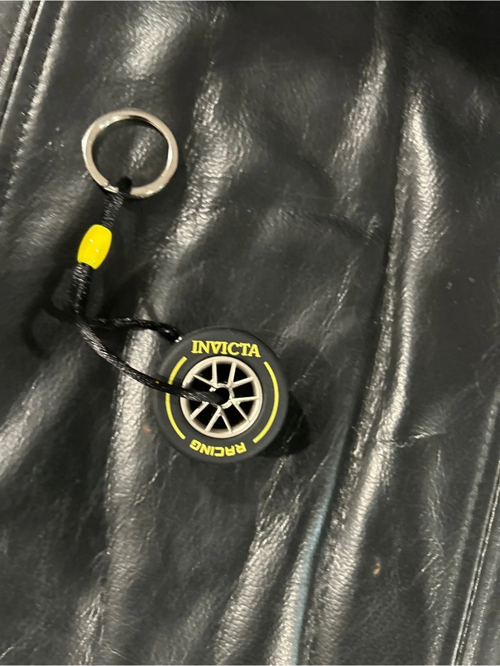 Invicta Black tire Keychain with Yellow Accent